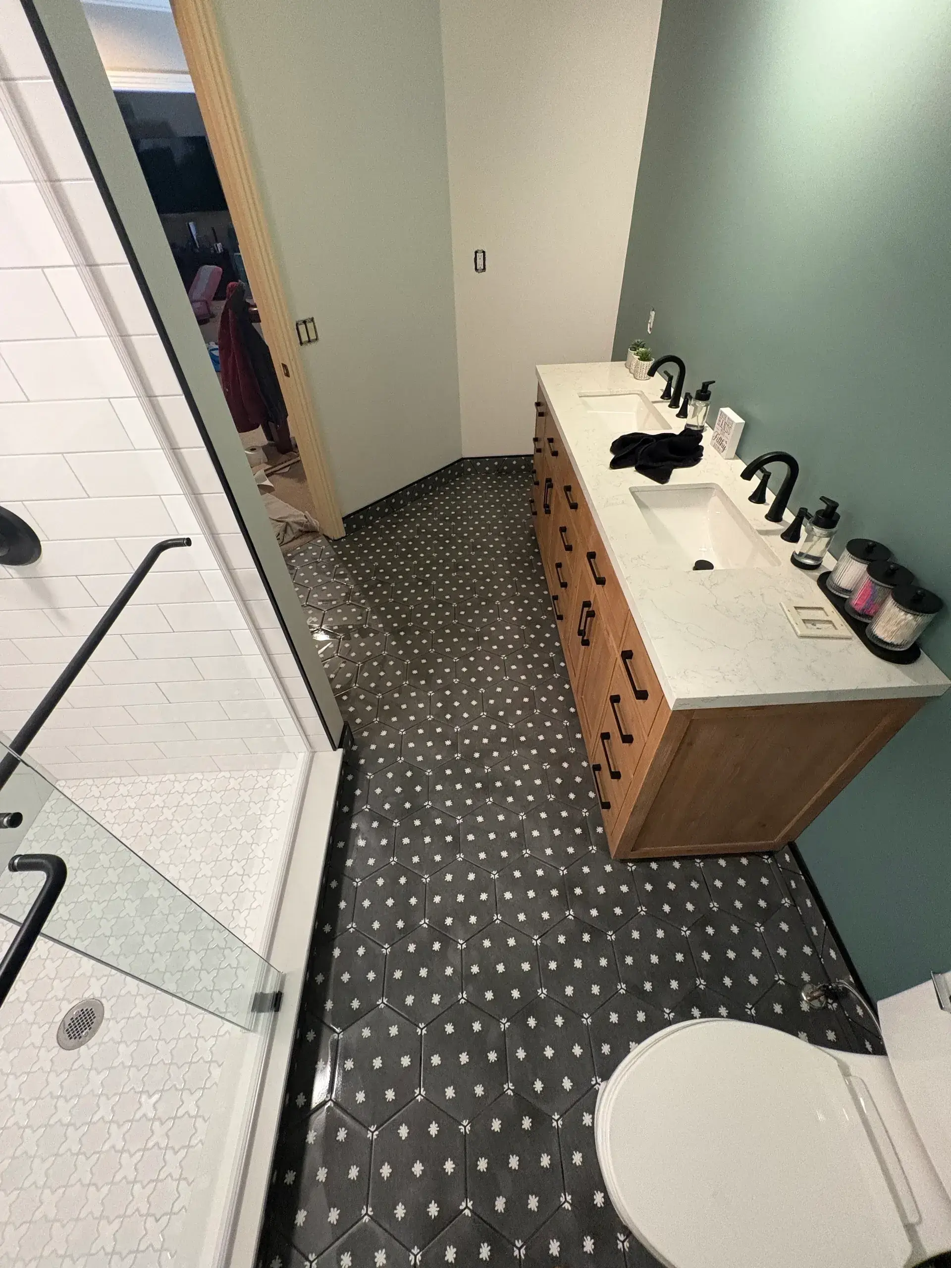 Modern bathroom with shower and vanity unit.